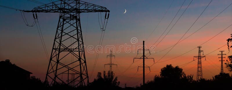 Electrical lines under a night sky with moon