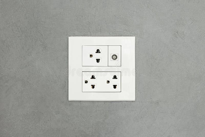 Electrical Outlet on Wall Loft Style, Power Plug on White Concrete Wall