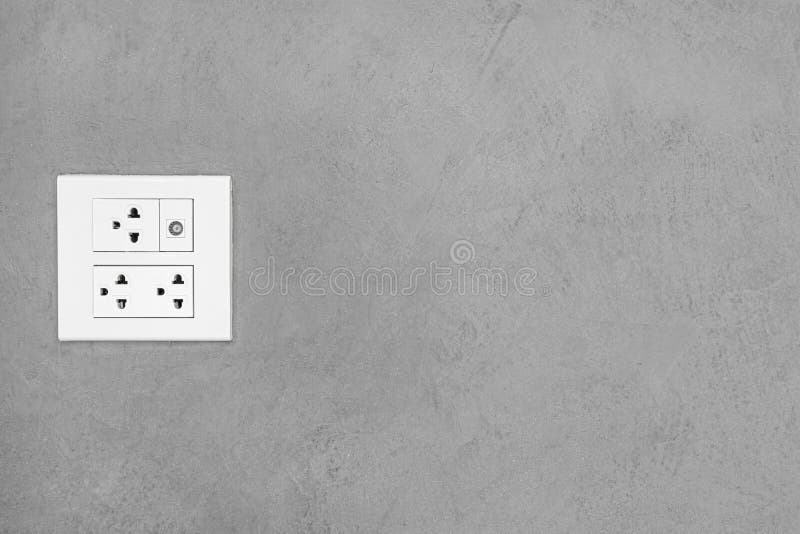 Electrical Outlet on Wall Loft Style, Power Plug on White Concrete Wall