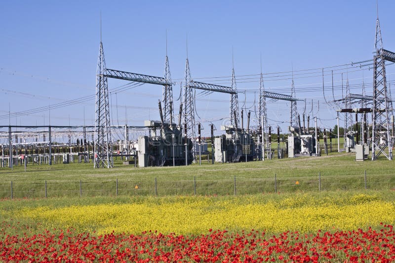 Electrical power plant in colorful meadow