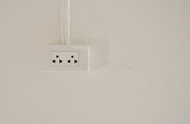 Electrical Power Socket Plug Outlet on White Concrete Wall Background
