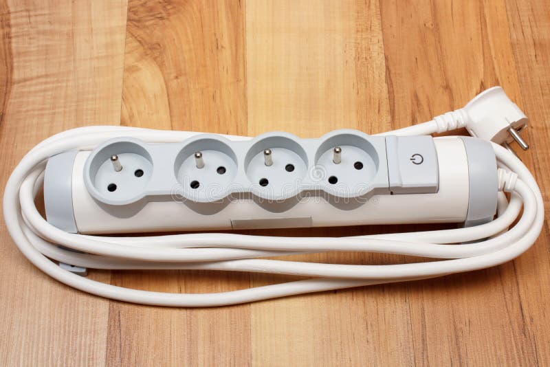 Electrical power strip with switch on-off on wooden floor stock photo