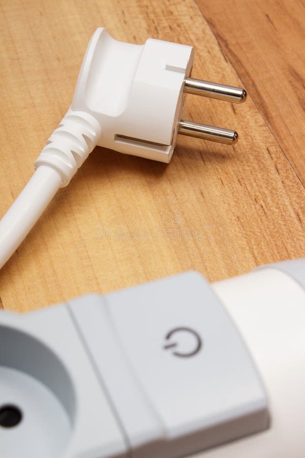 Electrical power strip with switch on-off on wooden floor royalty free stock image
