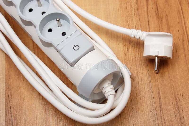 Electrical power strip with switch on-off on wooden floor royalty free stock photography