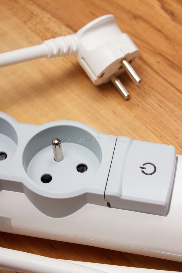 Electrical Power Strip with Switch onoff on Wooden Floor Stock Photo