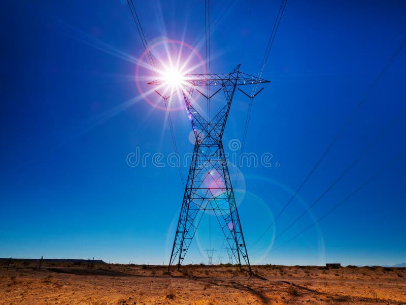 Electrical Power Tower Back Lit by the Sun Stock Photo Image of