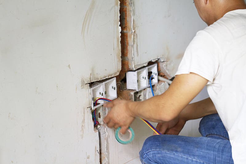 Electrical Renovation Work, Bury a Pvc Pipe in the Wall Stock Image