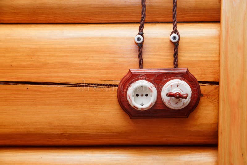 Electrical Socket and Switch in Retro Style on a Wooden Wall. Design of