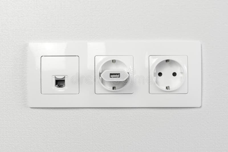 Electrical Sockets on the Wall with Black Connection Plug and White Switch Stock Photo Image