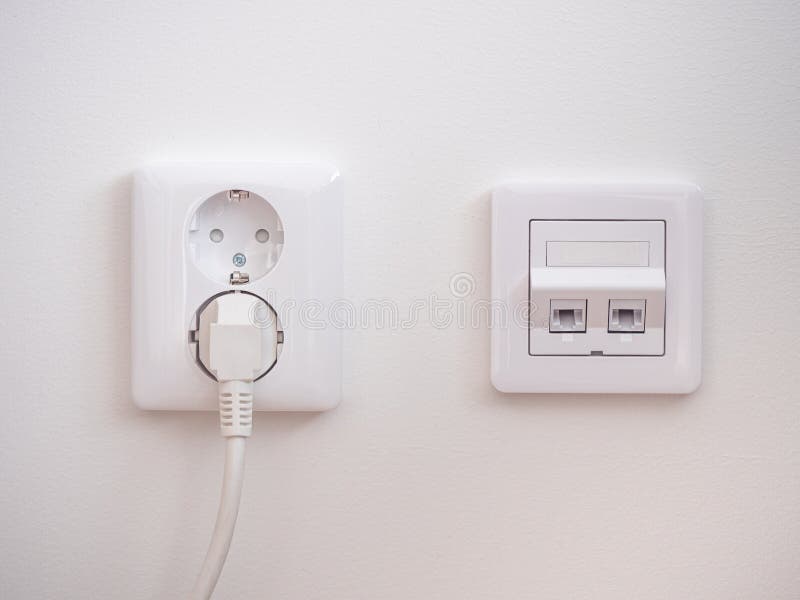 Electrical Sockets On The Wall With Black Connection Plug And White Switch Stock Photo Image