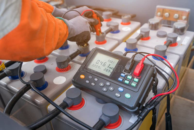 Electrical technician use milli ohm meter to measure internal resistance and voltage of batteries