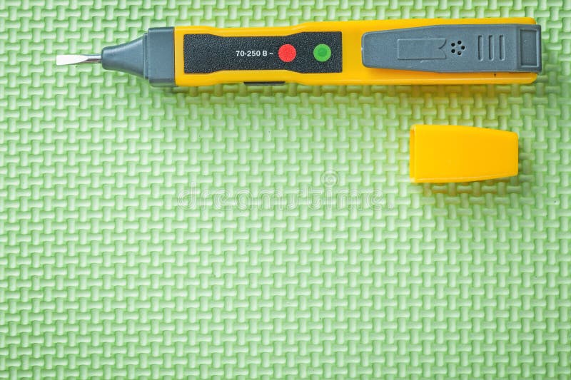 Electrical Tester on Green Background Electricity Concept Stock Image