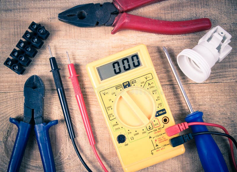 Electrical Tester and Other Tools of Electrician on a Wooden Background ...
