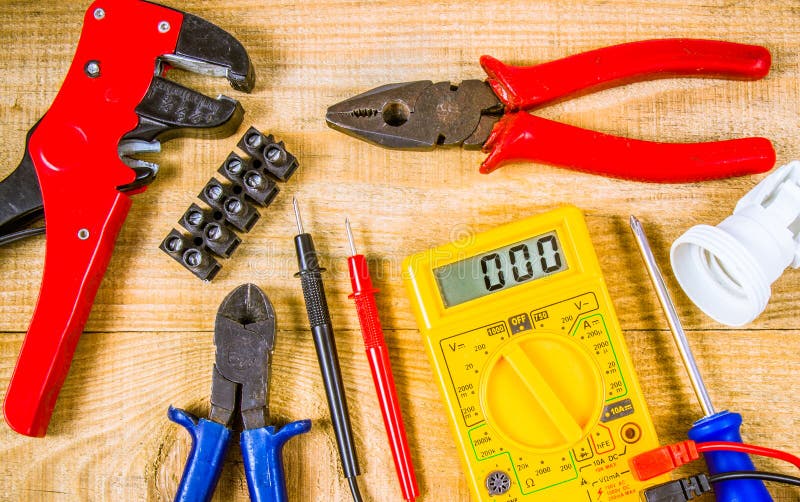 Electrical Tester And Other Tools Of Electrician On A Wooden Background ...