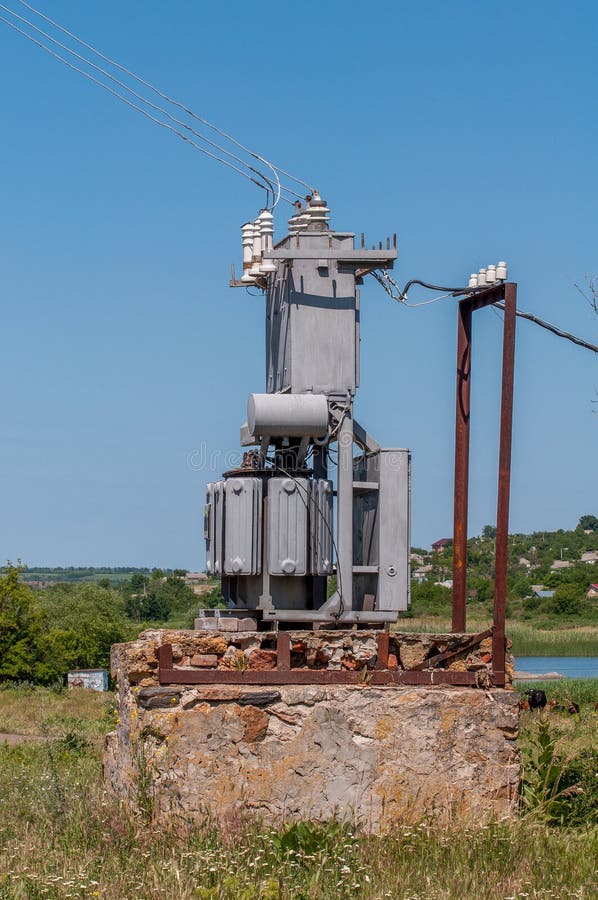 Electrical Transformer on a Stone Stand. Old Highvoltage Power Station