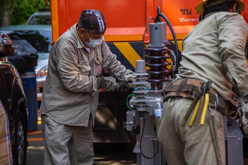 Electrical Wireman are Installing the Transformer To a Light Pole Editorial Photo Image of