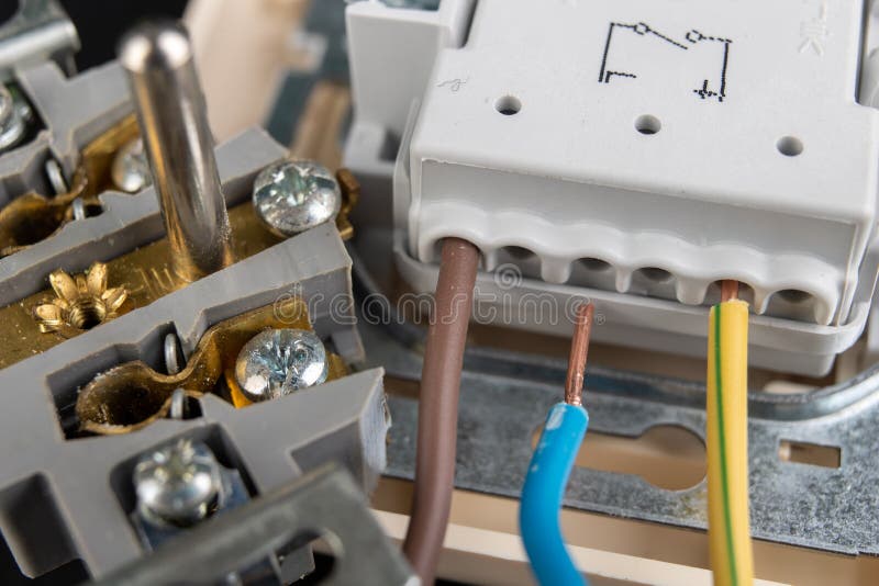 Electrical Wires Mounted To an Electrical Outlet. Electrical