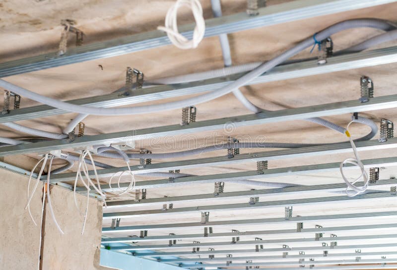 Electrical Wiring On The Concrete Ceiling In Drywall Stock Photo