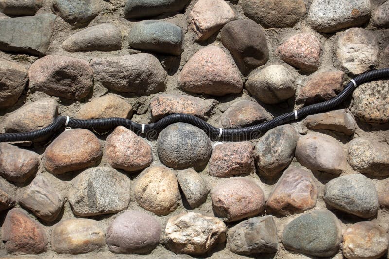 Electrical Wiring on the Wall of Stone Bricks. Stock Image Image of