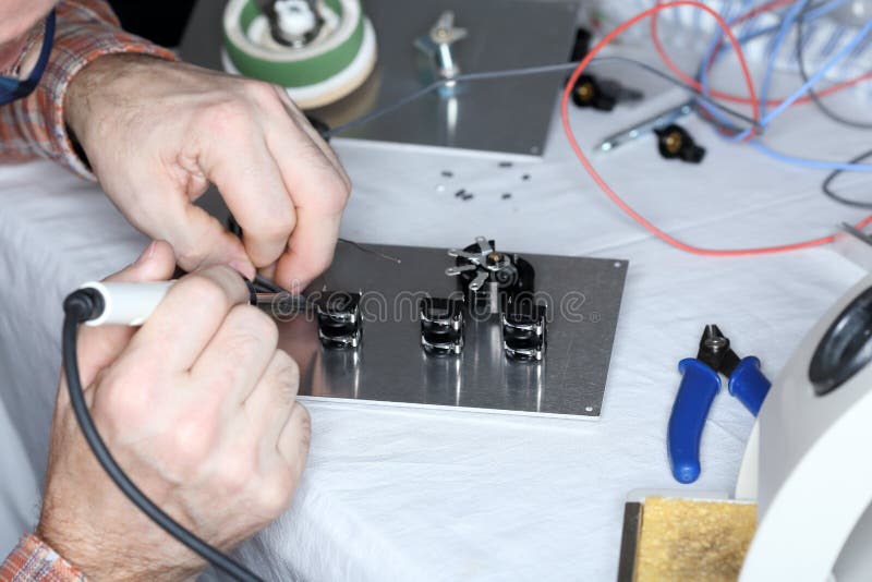 An Electrical Worker is Soldering Stock Photo Image of hardware