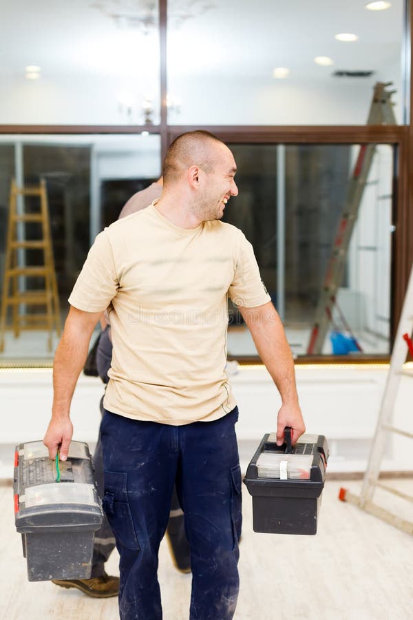 Electrician Carrying Tool Boxes after Work stock photos Electrician Carrying Tool Boxes after Work stock photos
