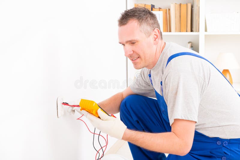 Electrician checking socket