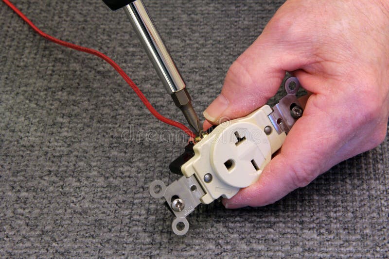 Electrician Connecting a Wire To an Outlet Stock Photo Image of