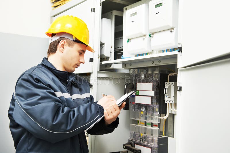Electrician engineer worker inspecting electrical data royalty free stock photography