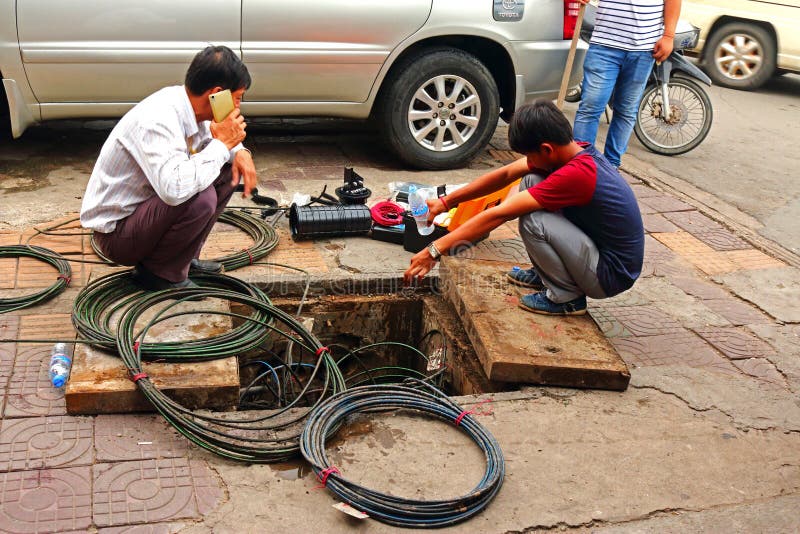 Electrician fixing cables on the street royalty free stock photos Electrician fixing cables on the street royalty free stock photos