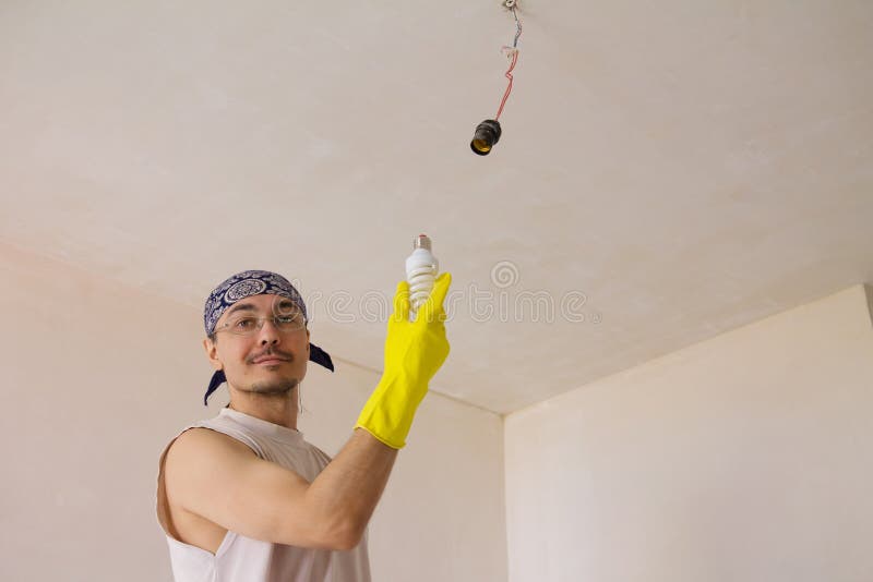Electrician Fixing Ceiling Light Stock Photo Image Of Change