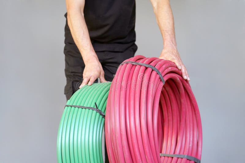 Worker with electrical protective tube royalty free stock photos Worker with electrical protective tube royalty free stock photos
