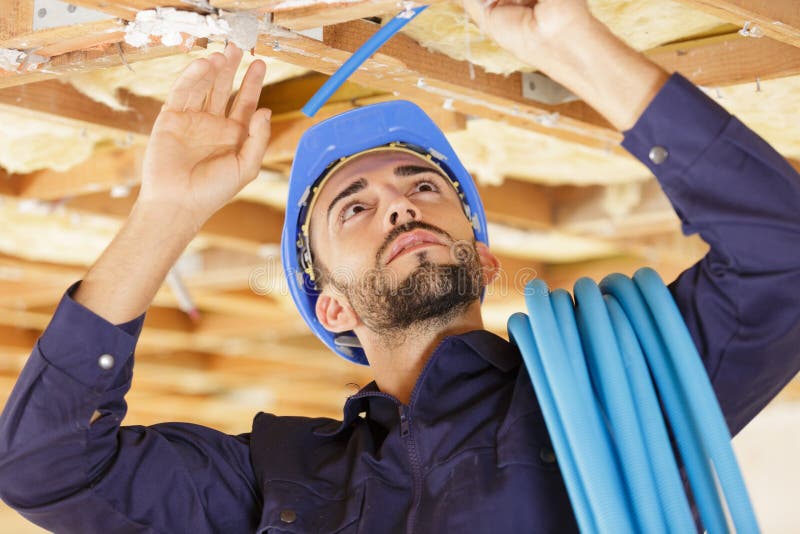 Electrician Installing Cables in Roof Stock Photo Image of hand, tool 265786798