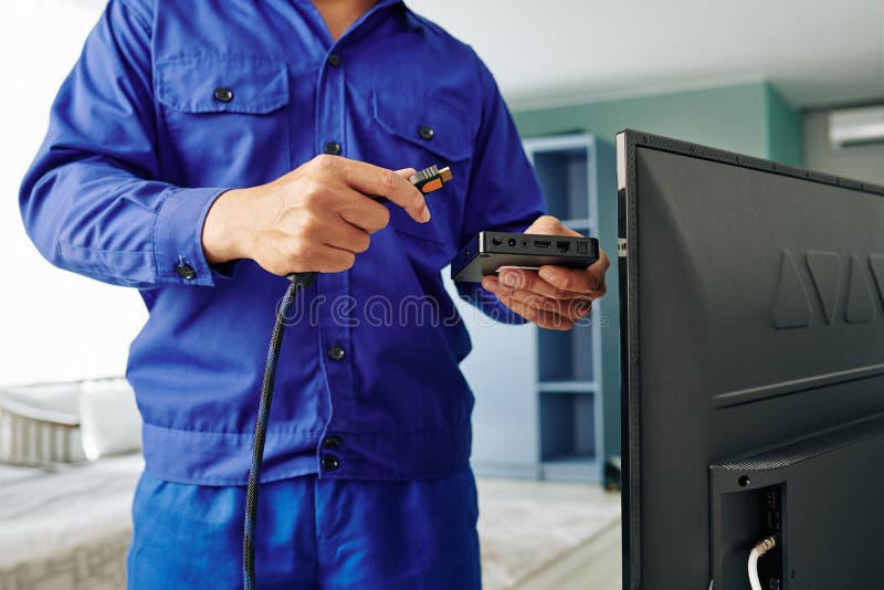 Electrician installing digital tv receiver