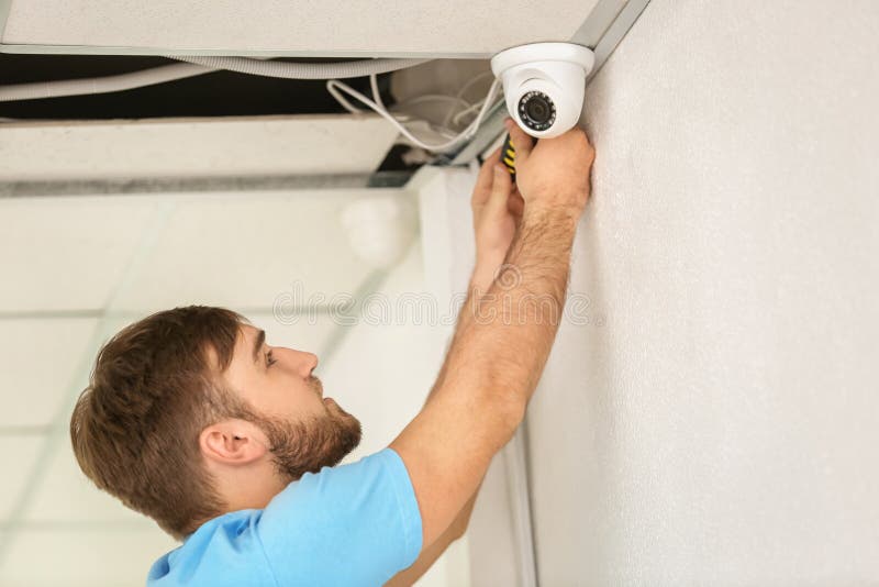 Electrician Installing Security Camera Indoors Stock Photo Image of