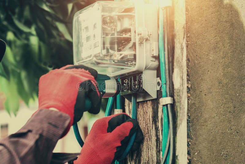 Electrician installing watthour meter at home. Home electrician stock images, royalty-free photos and pictures