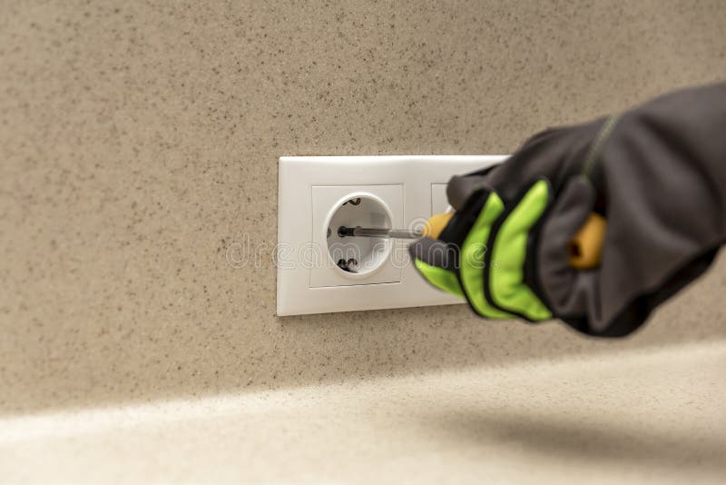 Installing Electrical Outlets. the Electrician Installs a Decorative