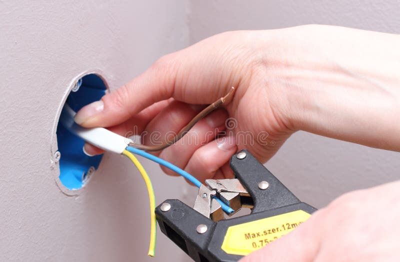 Electrician insulating electric wires royalty free stock photos