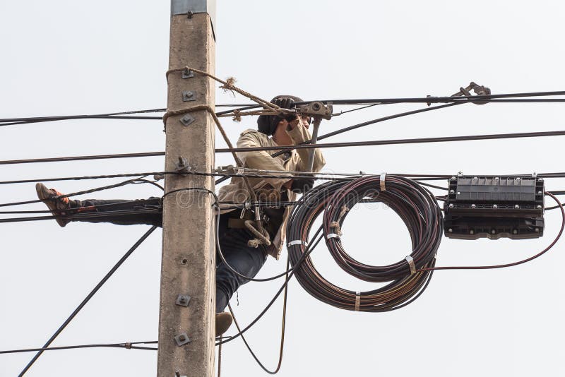 Electrician Man Work on Electric Pole. Editorial Stock Image Image of