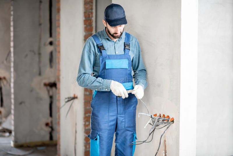 Electrician mounting wiring indoors royalty free stock images Electrician mounting wiring indoors royalty free stock images