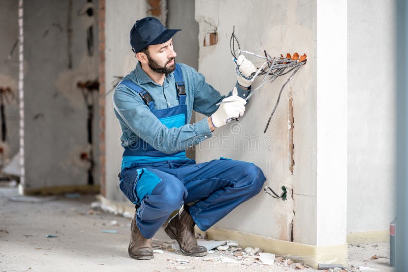 Electrician mounting wiring indoors royalty free stock photos Electrician mounting wiring indoors royalty free stock photos
