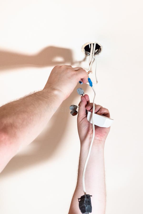 Electrician Mounts Electrical System for Lamp Stock Image Image of