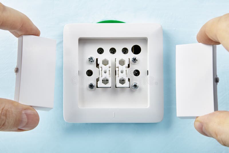 Electrician puts buttons on push stock photo Electrician puts buttons on push stock photo