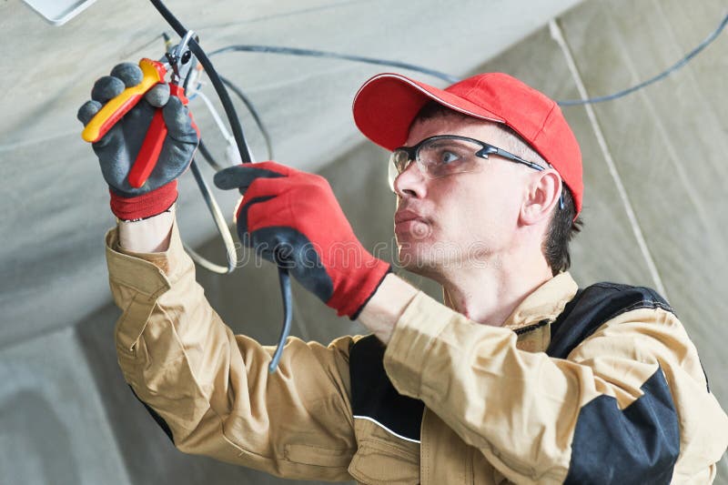 Electrician service. Installer works with cable royalty free stock photos Electrician service. Installer works with cable royalty free stock photos