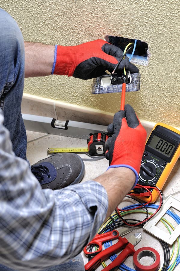 Electrician Technician at Work with Safety Equipment on a Residential