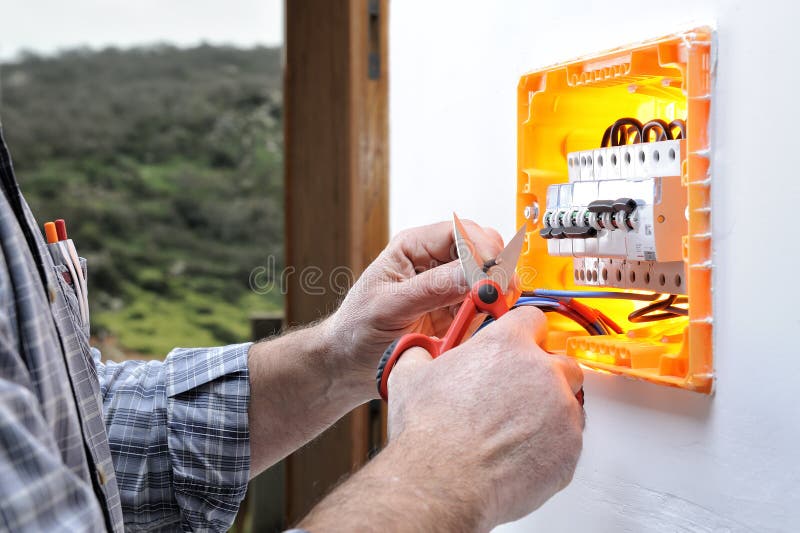 Electrician Technician Repairs the Electrical Panel of a Residential
