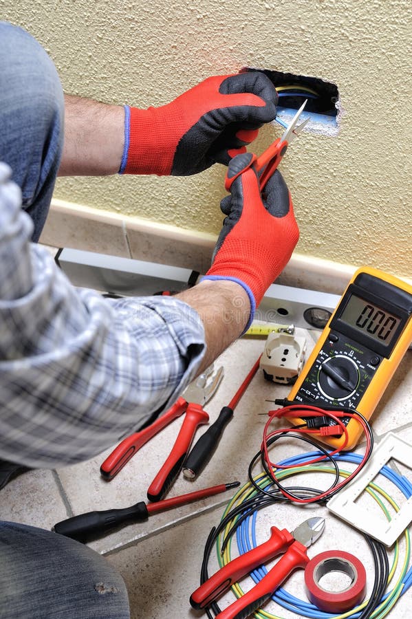 Electrician Technician at Work with Safety Equipment on a Residential