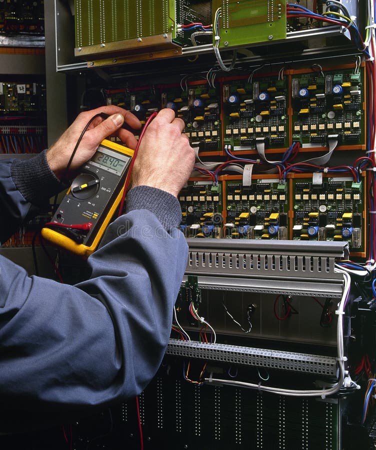 Electrician testing industrial machine