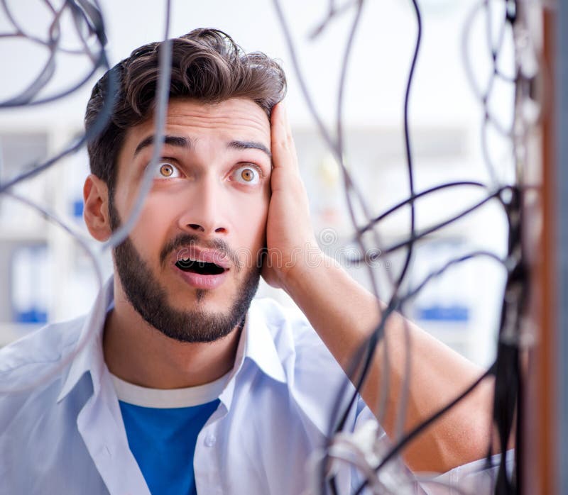 Electrician trying to untangle wires in repair concept royalty free stock photos Electrician trying to untangle wires in repair concept royalty free stock photos