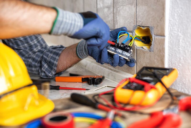 Electrician at Work with Safety Equipment on a Residential Electrical