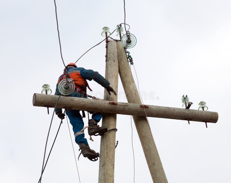 Electrician Working on the Power Lines after the Accident Stock Image